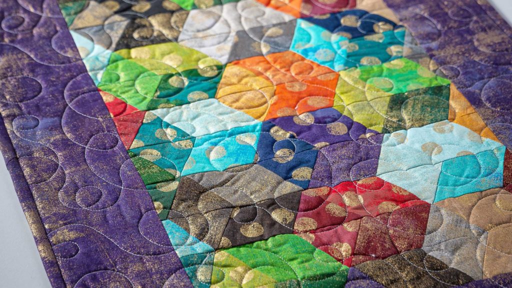 The Mini Rhombus Table Runner Quilt from Missouri Star Quilt Co. Watch the free quilt tutorial today and purchase quilting notions and supplies!