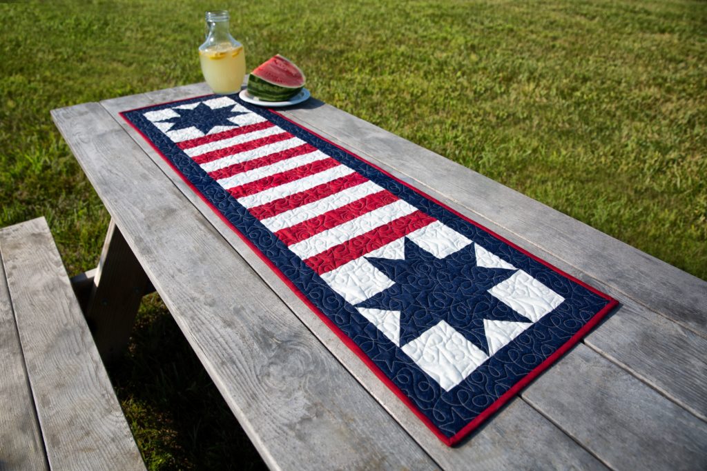 The Stars and Stripes Table Runner Quilt from Missouri Star Quilt Co. Watch the free quilt tutorial today!