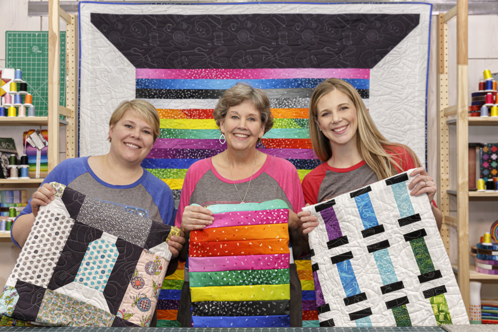 Natalie, Jenny, and Misty and their triple play spools quilts for Missouri Star Quilt Company.